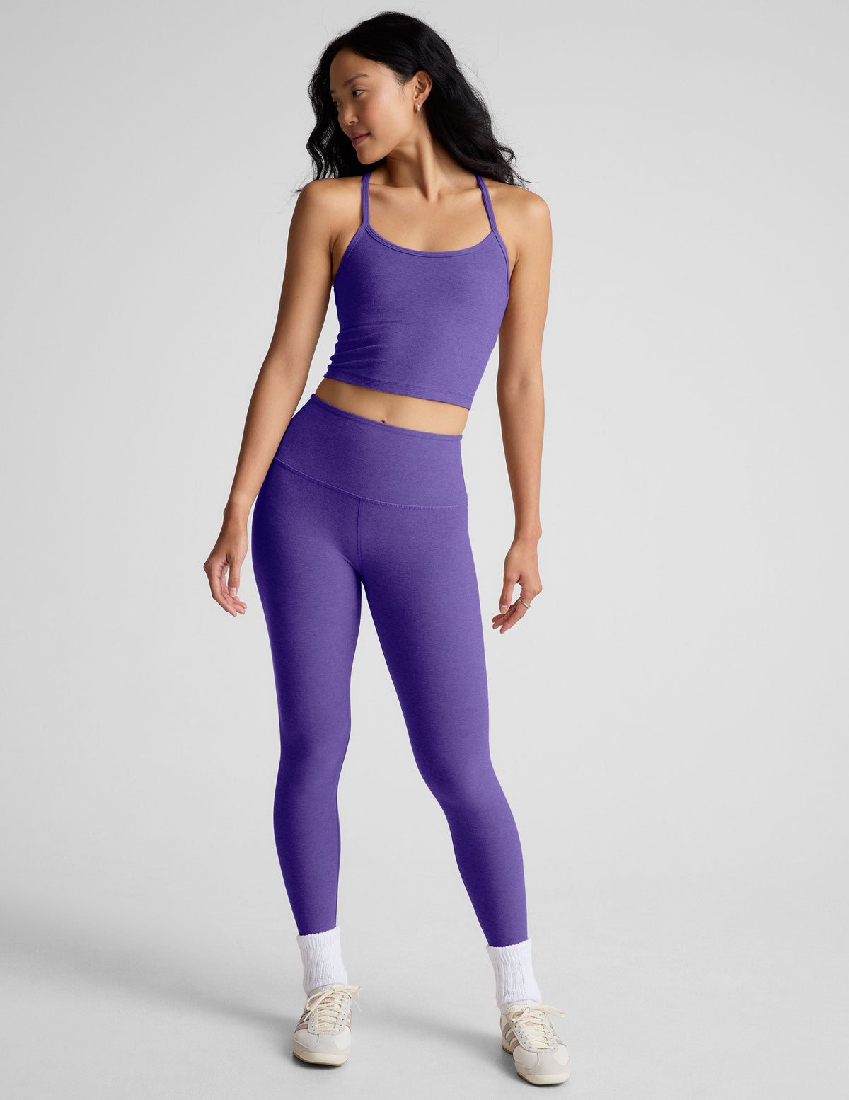 purple high-waisted midi length leggings.