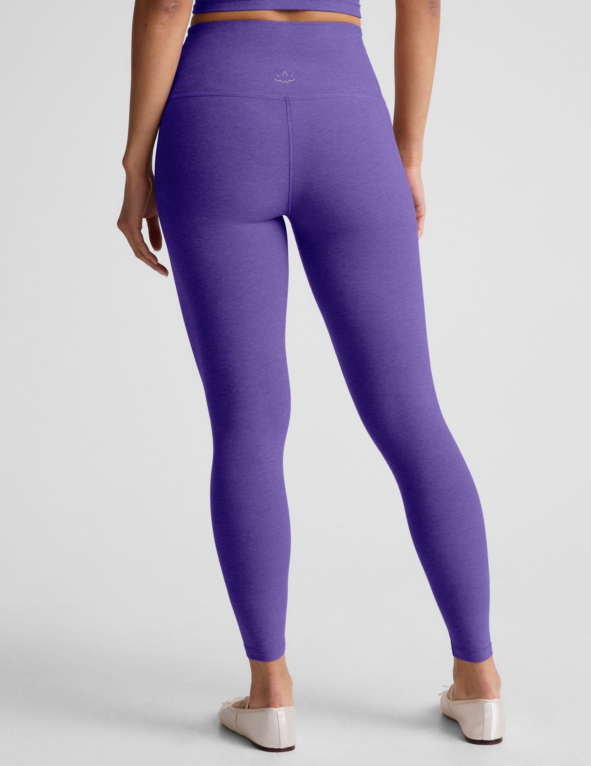 purple high-waisted midi length leggings.