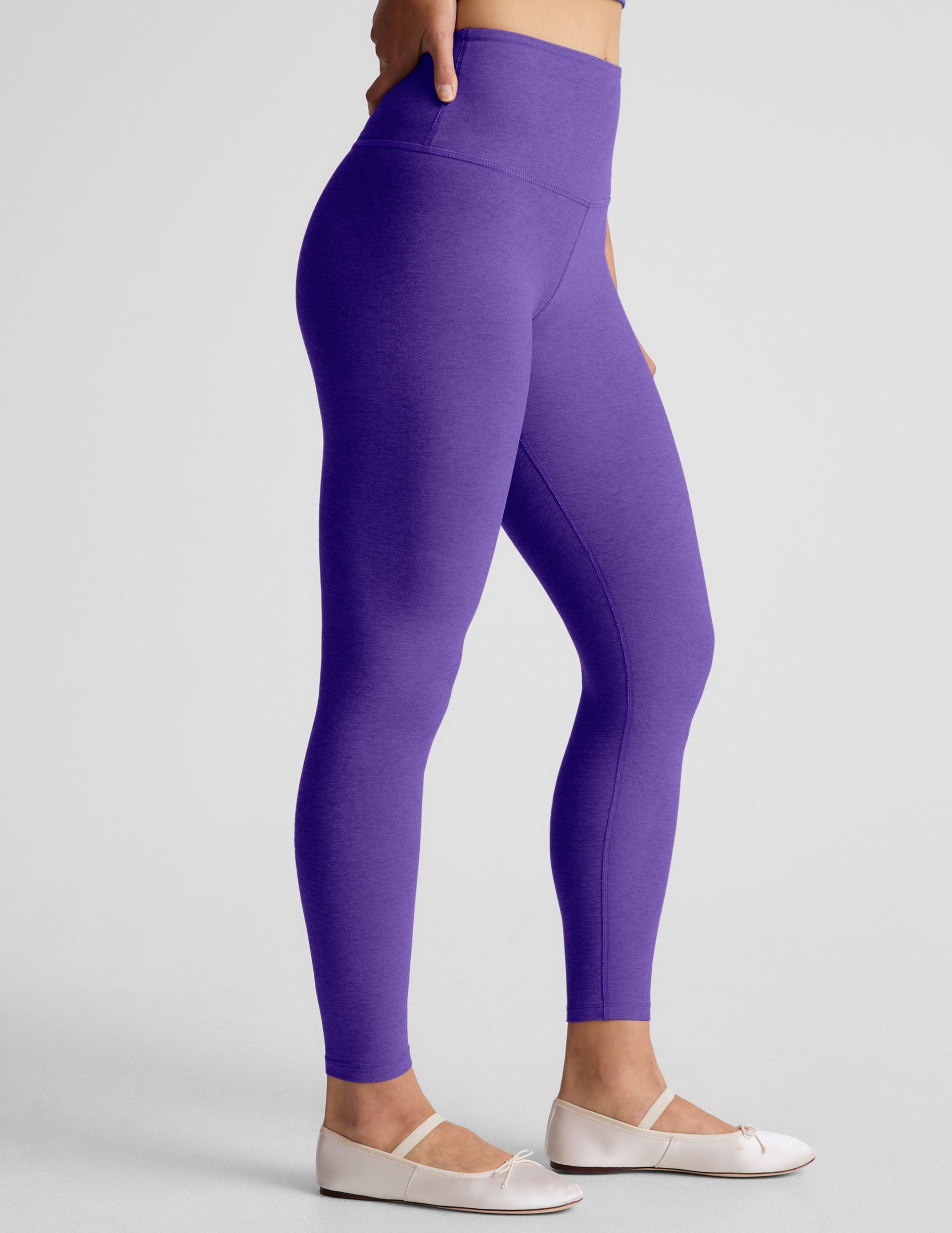 purple high-waisted midi length leggings.