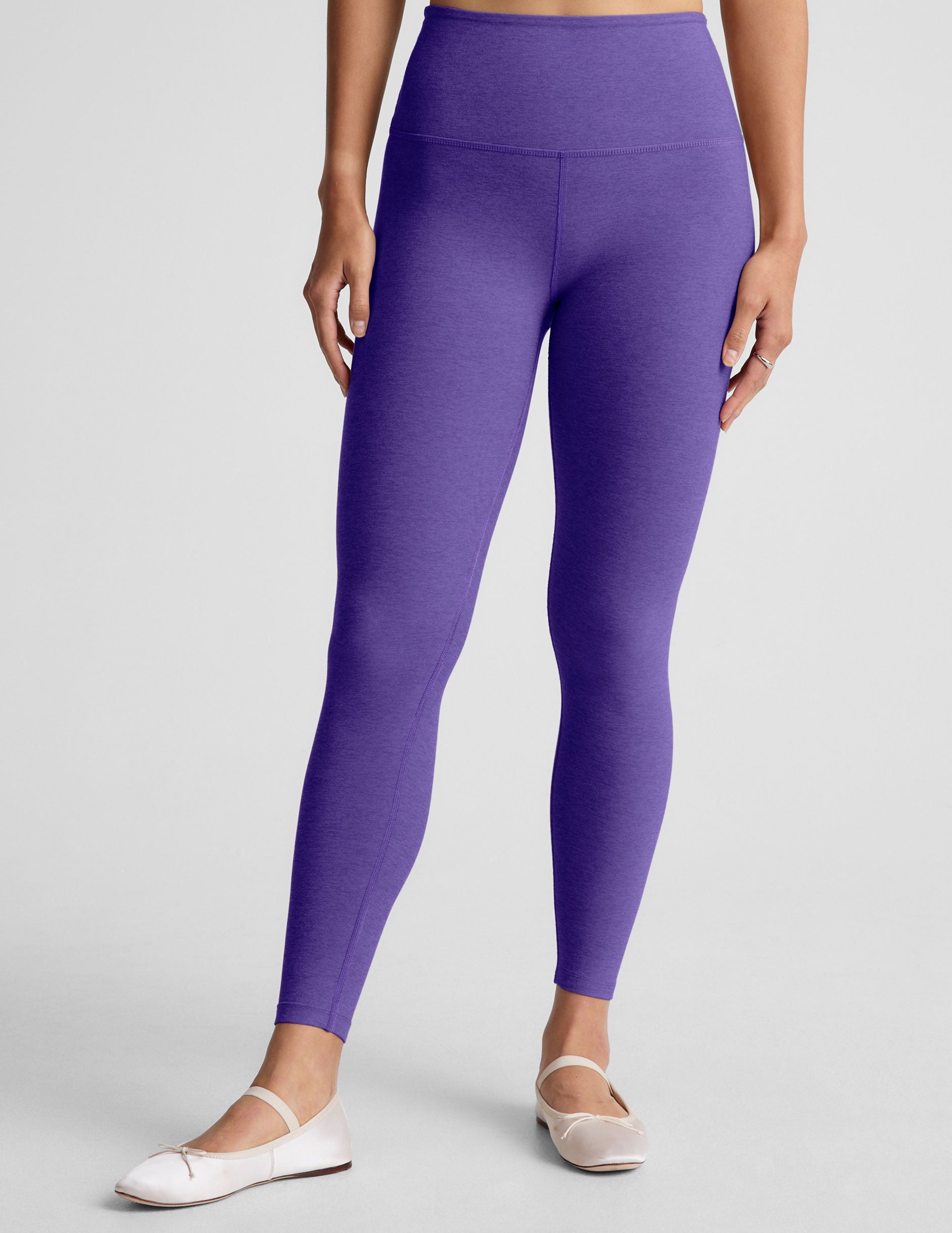 purple high-waisted midi length leggings.