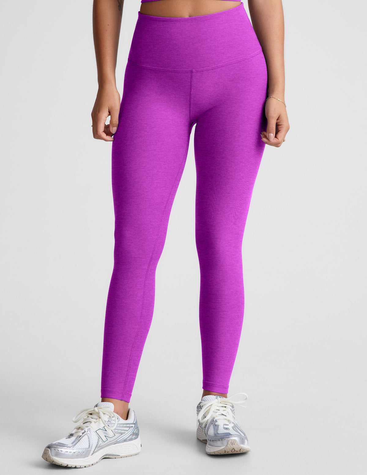purple high-waisted midi length leggings.
