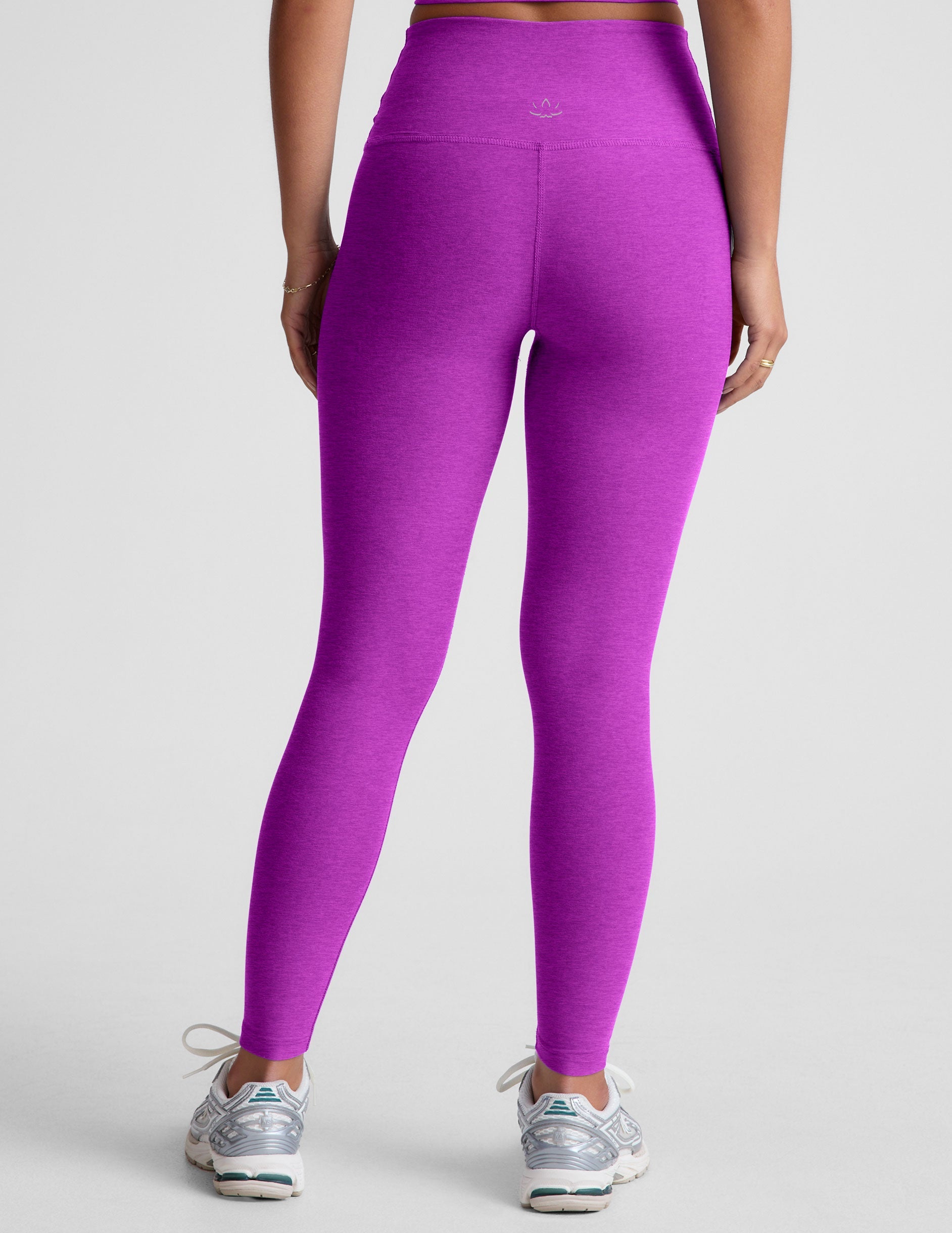 purple high-waisted midi length leggings.