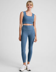 blue high-waisted midi length legging.