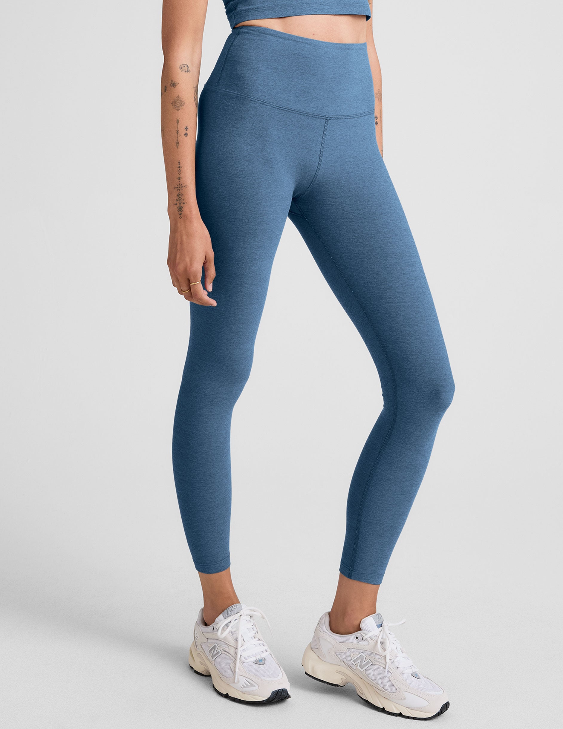 blue high-waisted midi length legging.