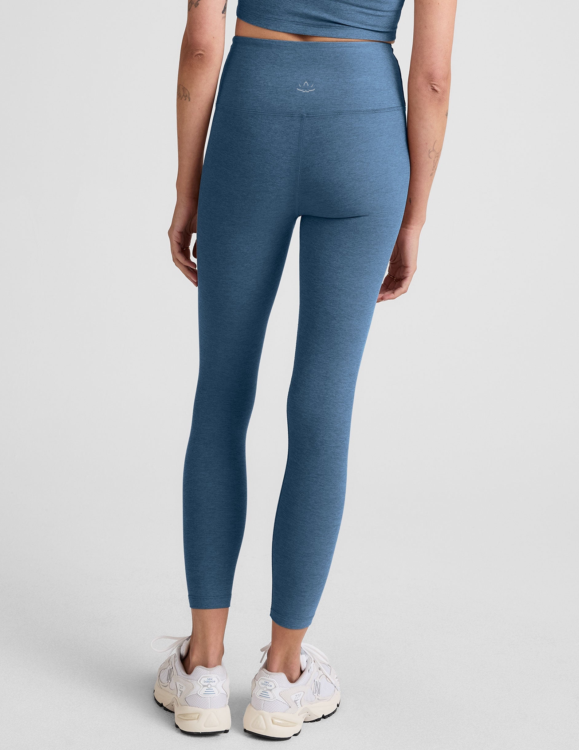 blue high-waisted midi length legging.