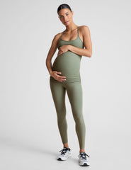 green high-waisted midi length maternity leggings.