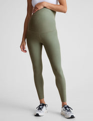 green high-waisted midi length maternity leggings.