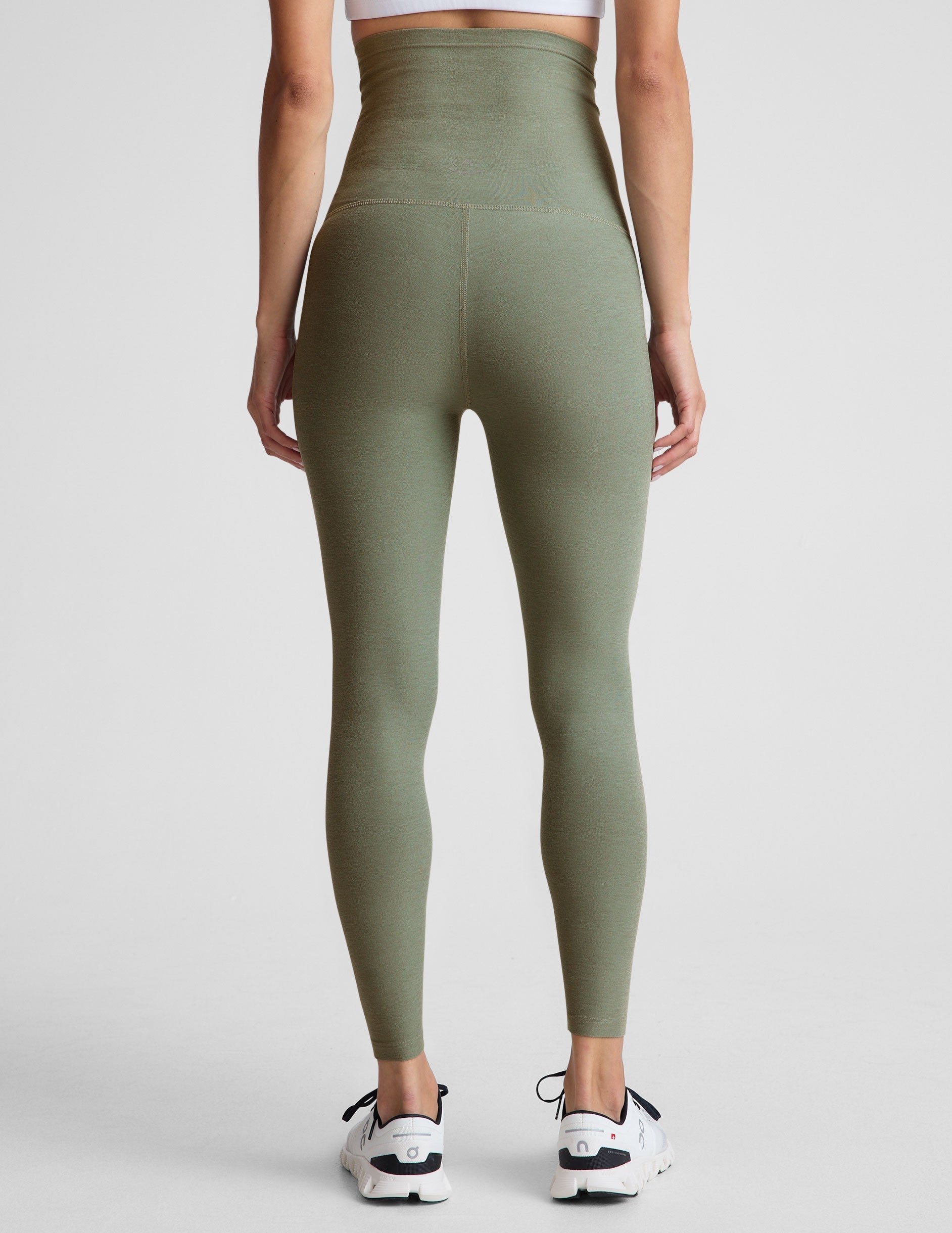 green high-waisted midi length maternity leggings.