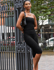 black high-waisted pedal pusher length leggings.