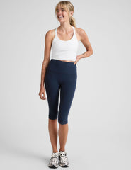blue high-waisted pedal pusher length leggings.
