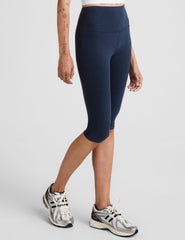 blue high-waisted pedal pusher length leggings.