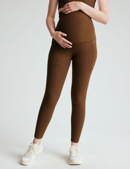 brown high-waisted maternity leggings with pockets.