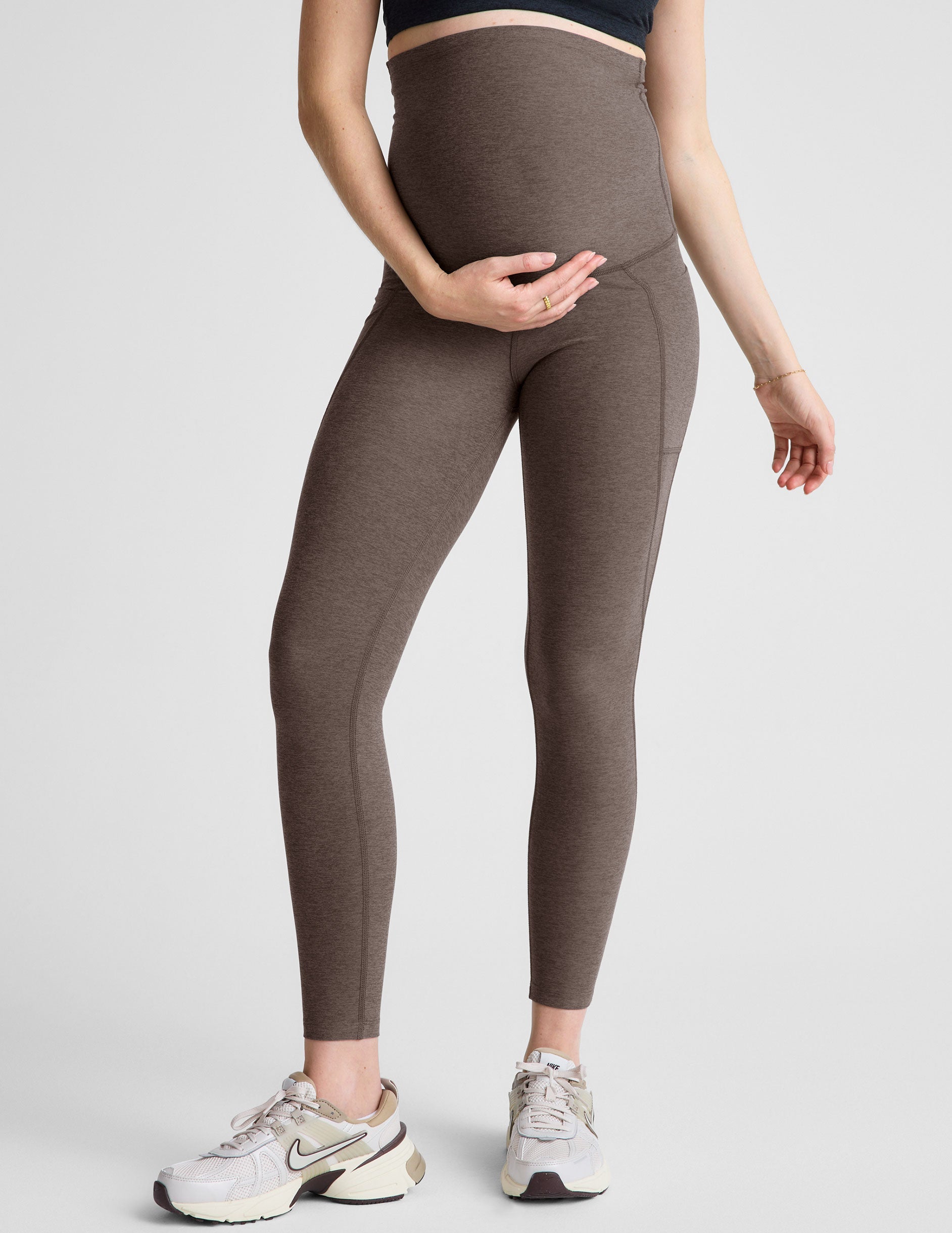 brown maternity midi leggings with side pockets.