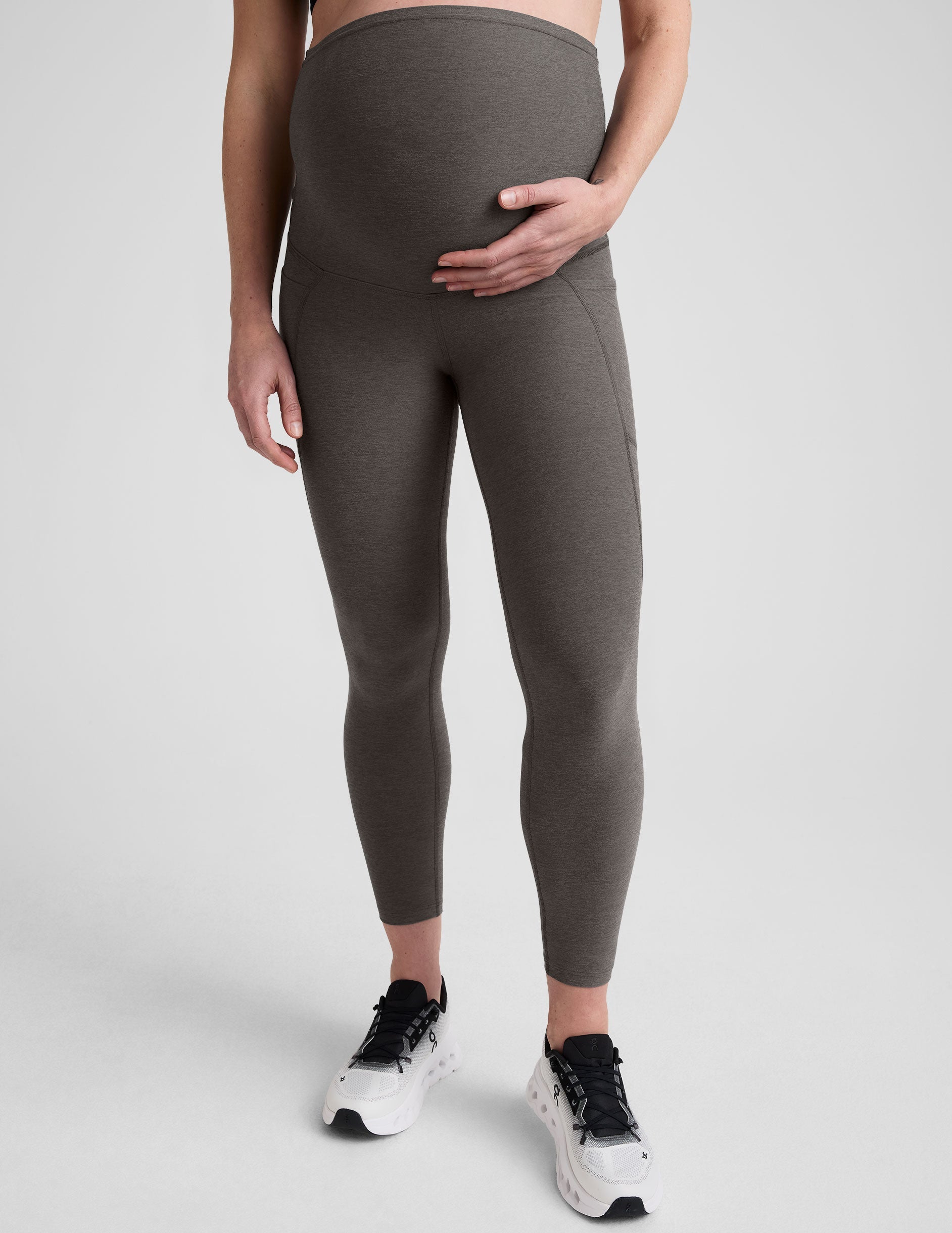 grey midi length maternity leggings with side pockets.