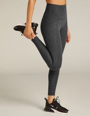 black charcoal high-waisted midi leggings with pockets.