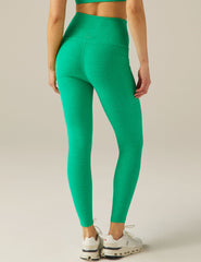 green midi legging with pocket detail at sides