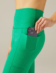 green midi legging with pocket detail at sides