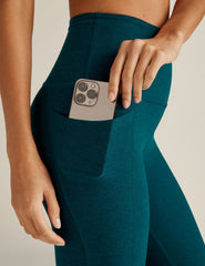 blue high-waisted midi spacedye leggings with side pockets.