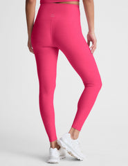 pink high-waisted midi length leggings with a crossover detail on the front waistband.