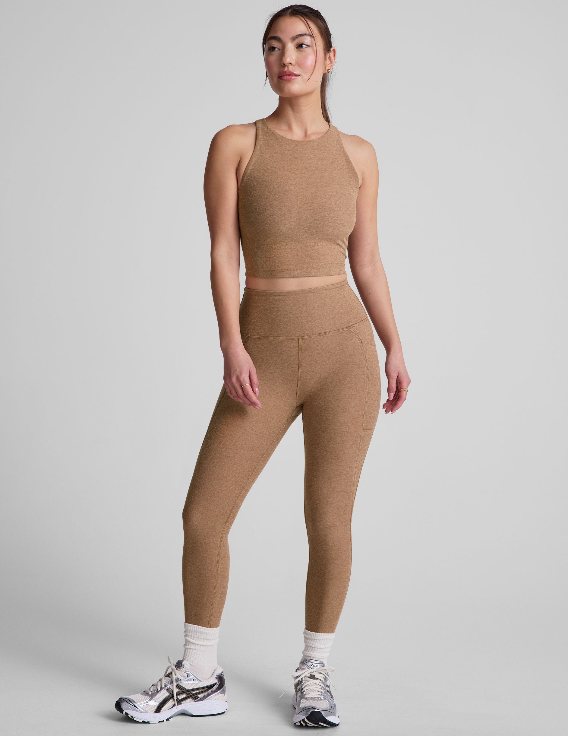 brown high-waisted capri length leggings with pockets.