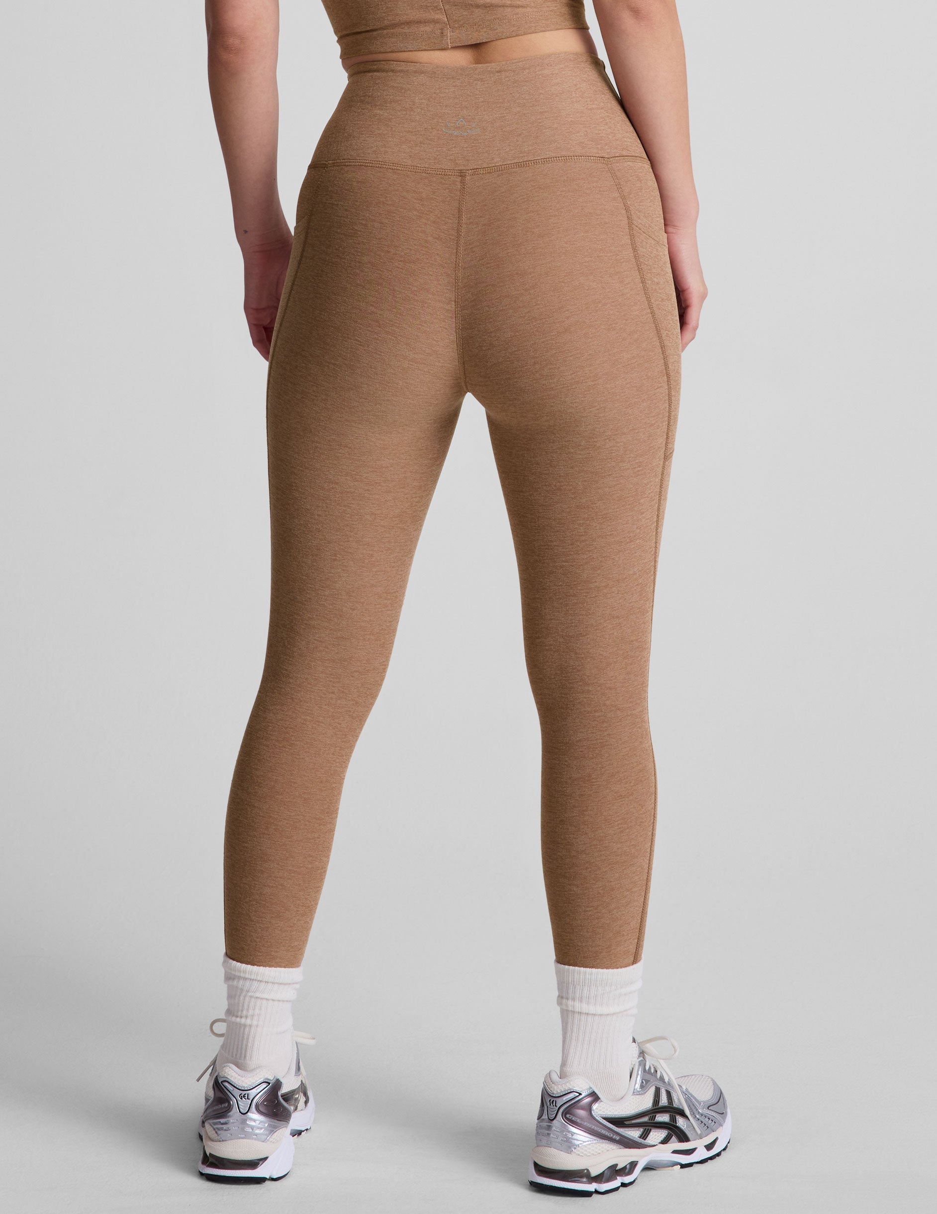 brown high-waisted capri length leggings with pockets.
