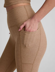 brown high-waisted capri length leggings with pockets.