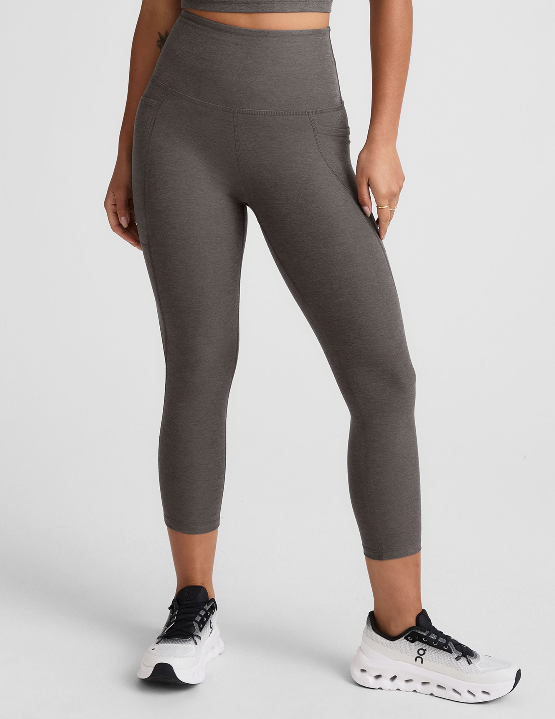 gray high-waisted capri length leggings with pockets.
