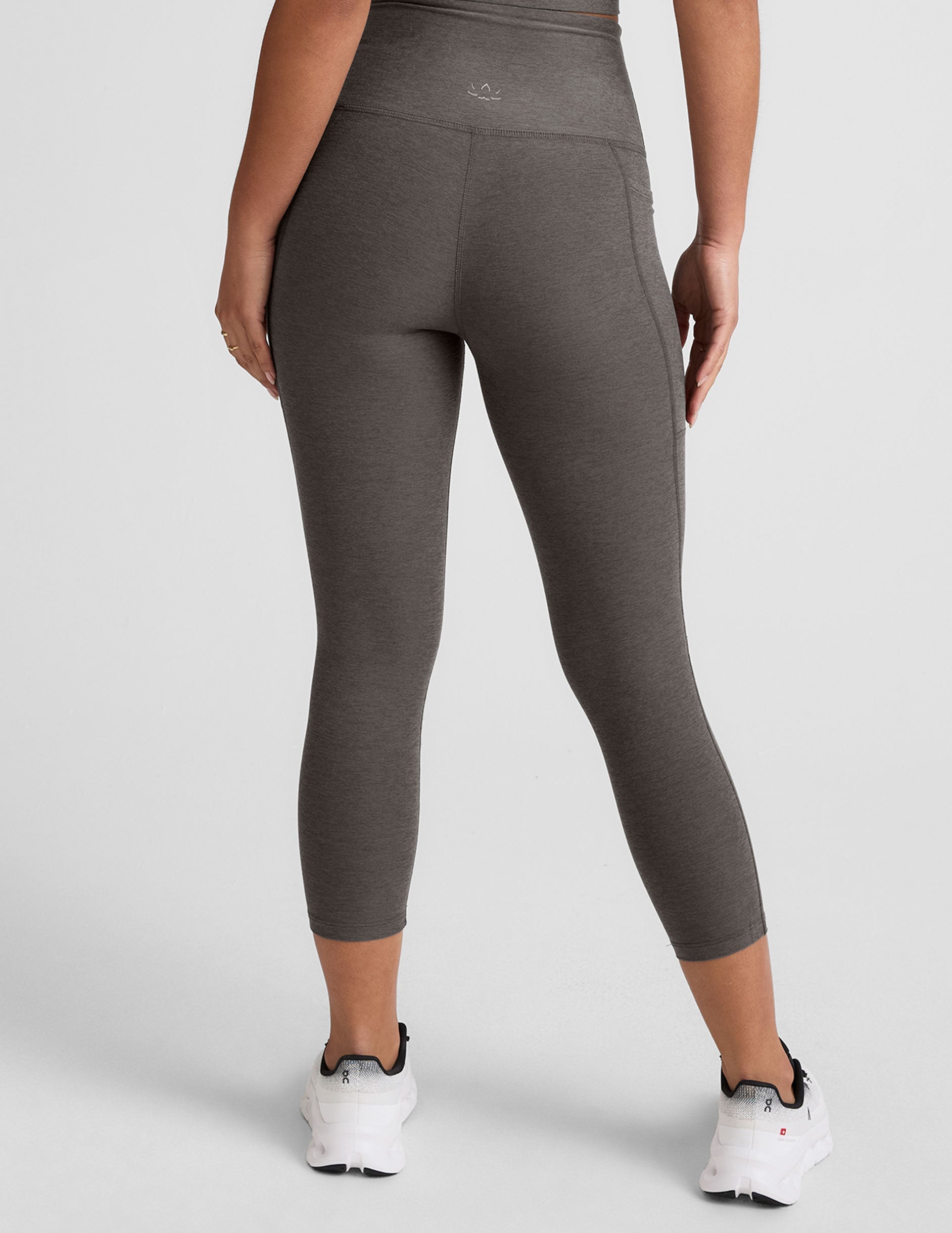 gray high-waisted capri length leggings with pockets.