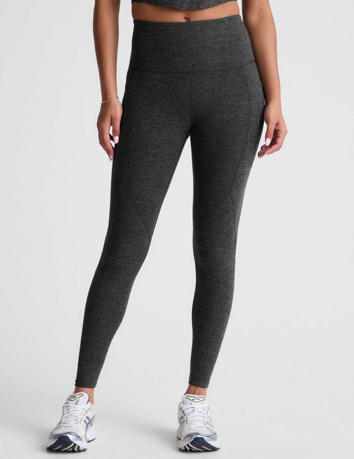 black-charcoal high-waisted midi leggings with side pockets.