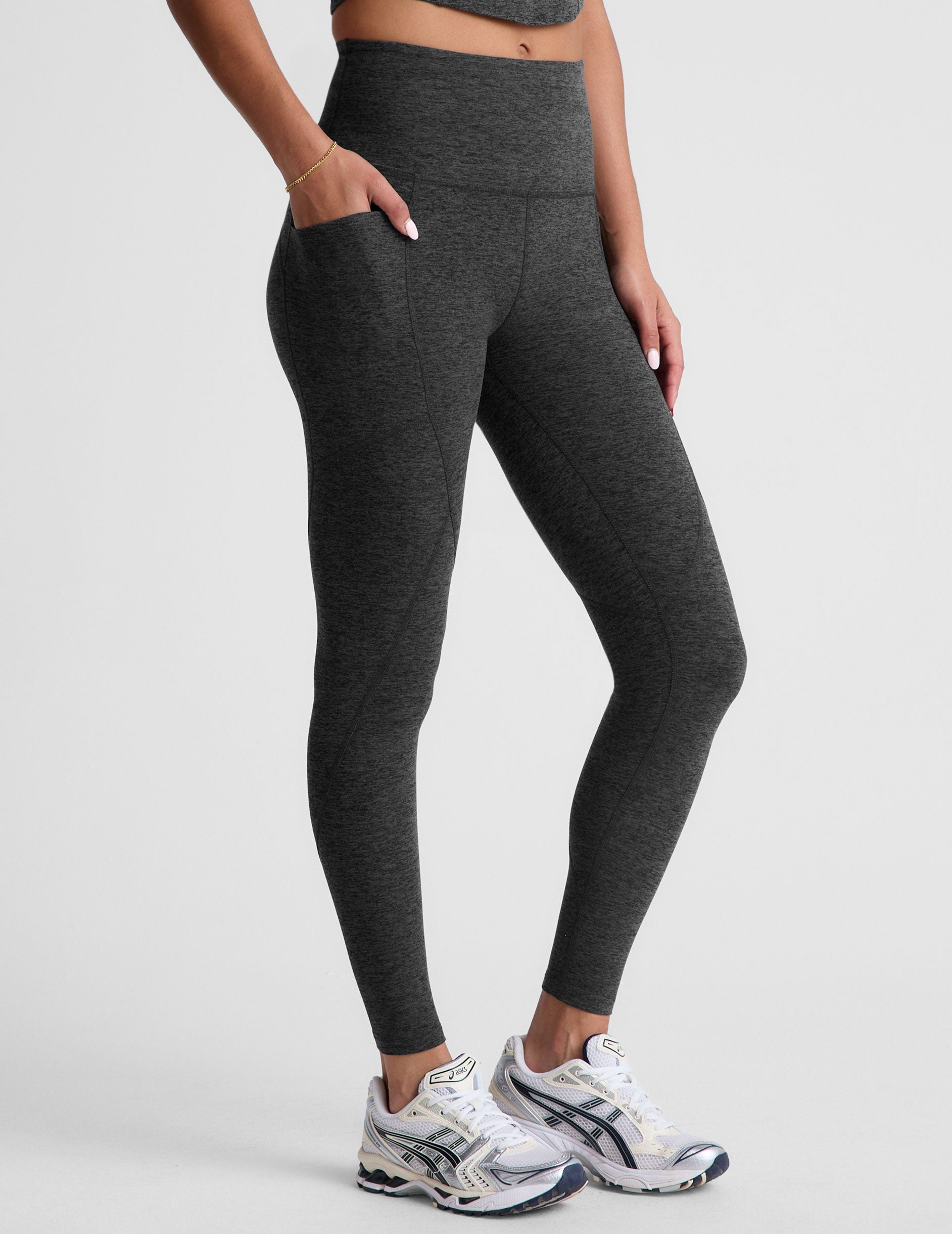 black-charcoal high-waisted midi leggings with side pockets.