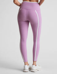 purple high-waisted midi length legging with pockets and white piping.