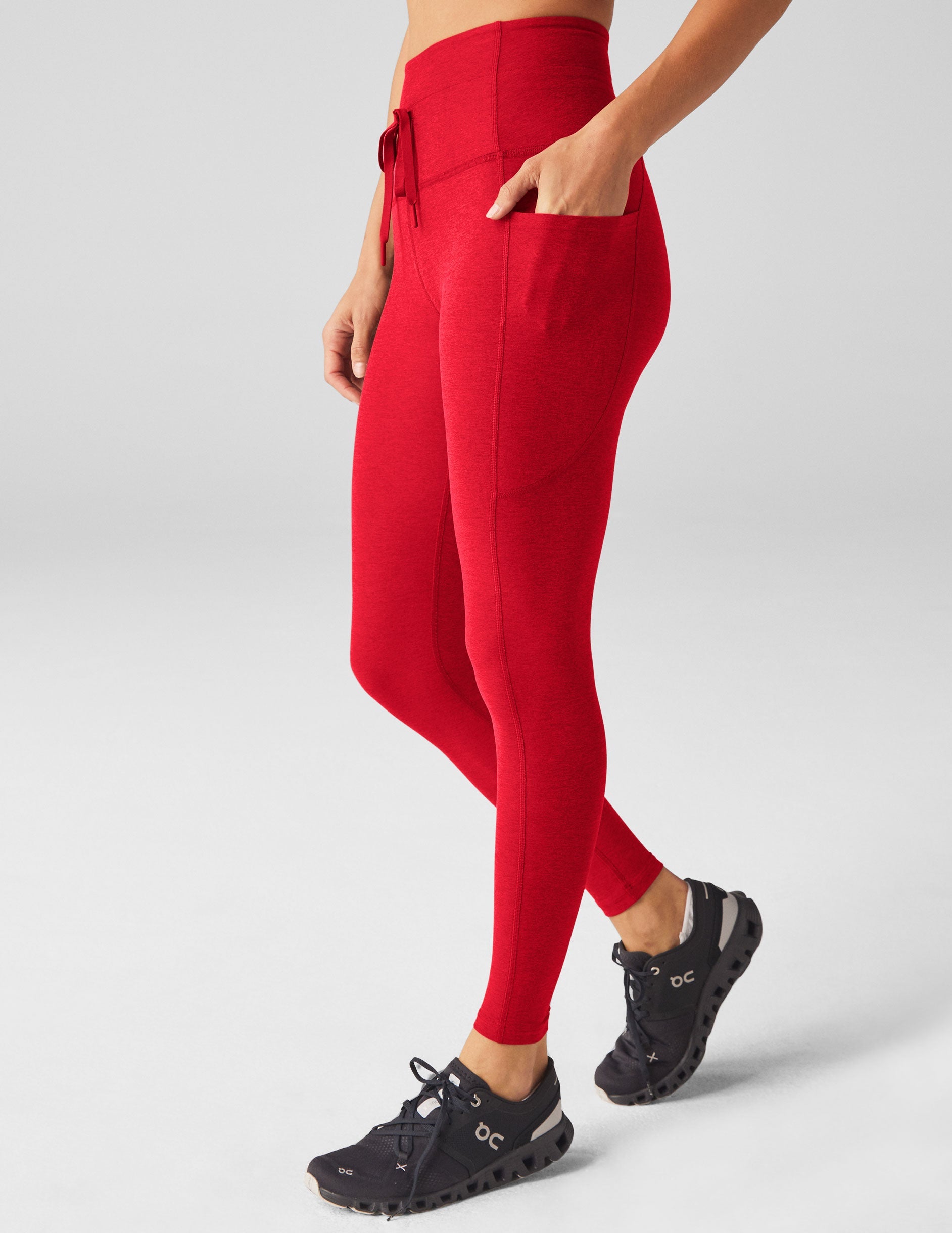 red high-waisted midi leggings with a drawstring at waistband.