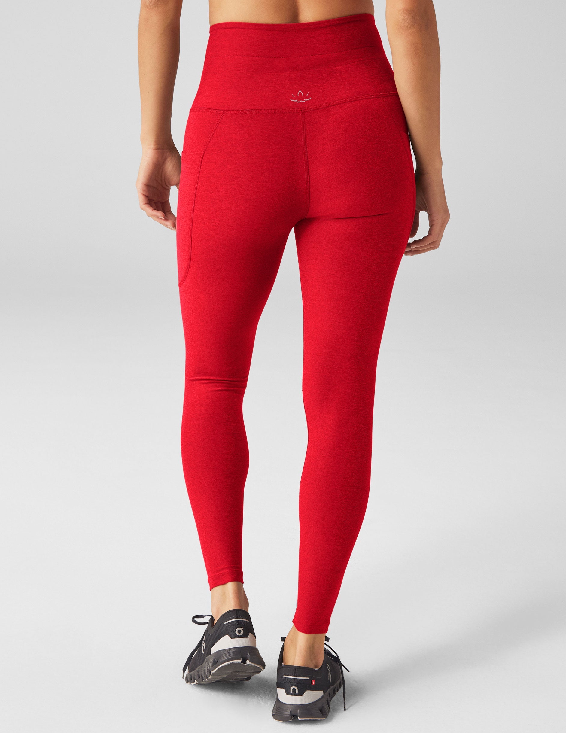 red high-waisted midi leggings with a drawstring at waistband.