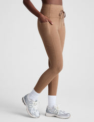 brown high-waisted midi leggings with a drawstring at waistband.