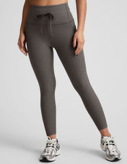 gray high-waisted midi length leggings with a drawstring at waistband and side pockets.