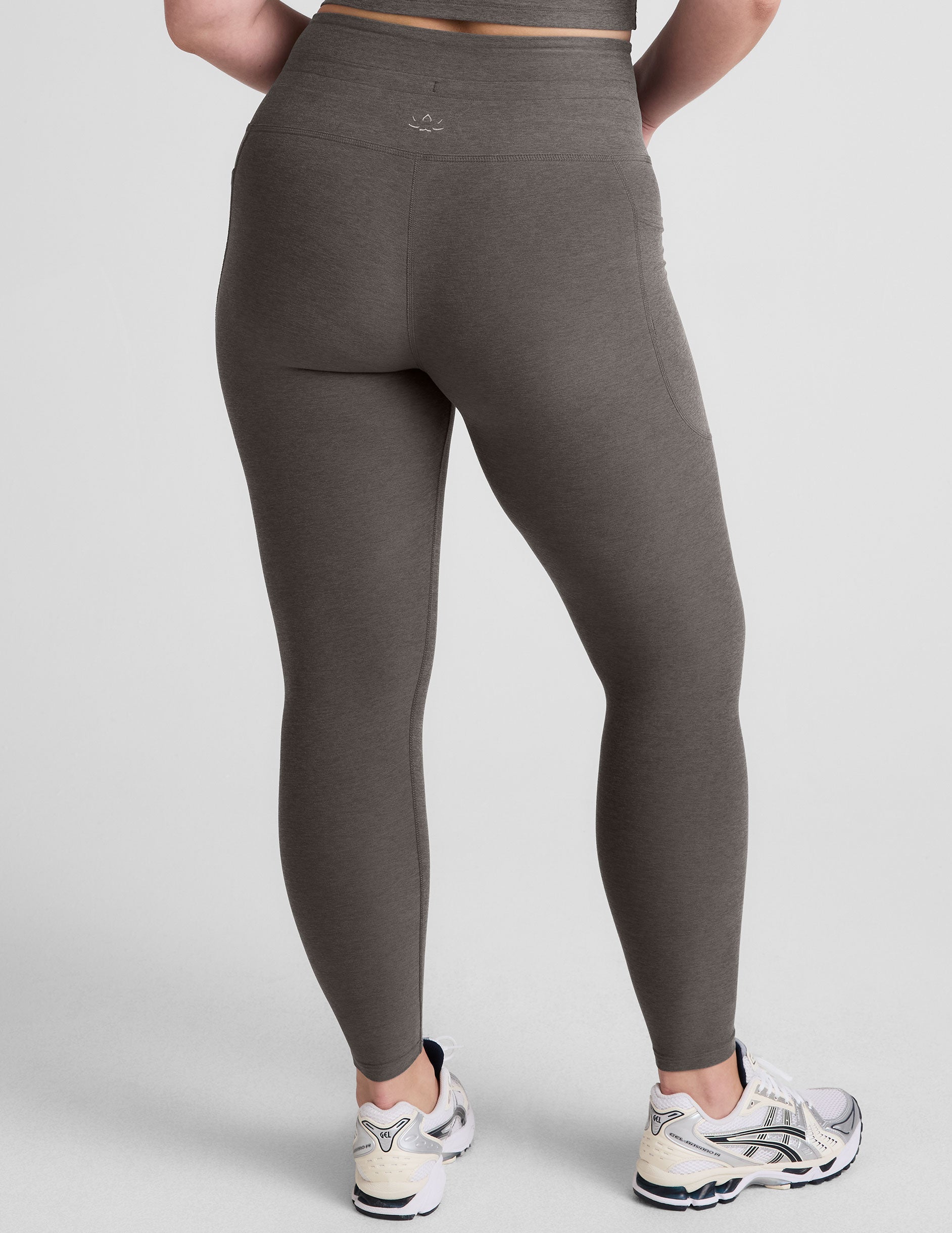 gray high-waisted midi length leggings with a drawstring at waistband and side pockets.