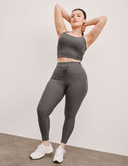 gray high-waisted midi length leggings with a drawstring at waistband and side pockets.