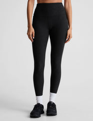 black high-waisted midi length legging with a shirred detail on the sides of the waistband.