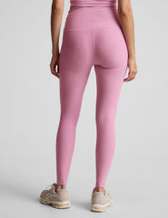 pink high-waisted midi length leggings with shirred detailing on the side of each waistband.