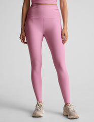pink high-waisted midi length leggings with shirred detailing on the side of each waistband.