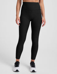 black high-waisted midi length leggings with white contrast piping at sides.