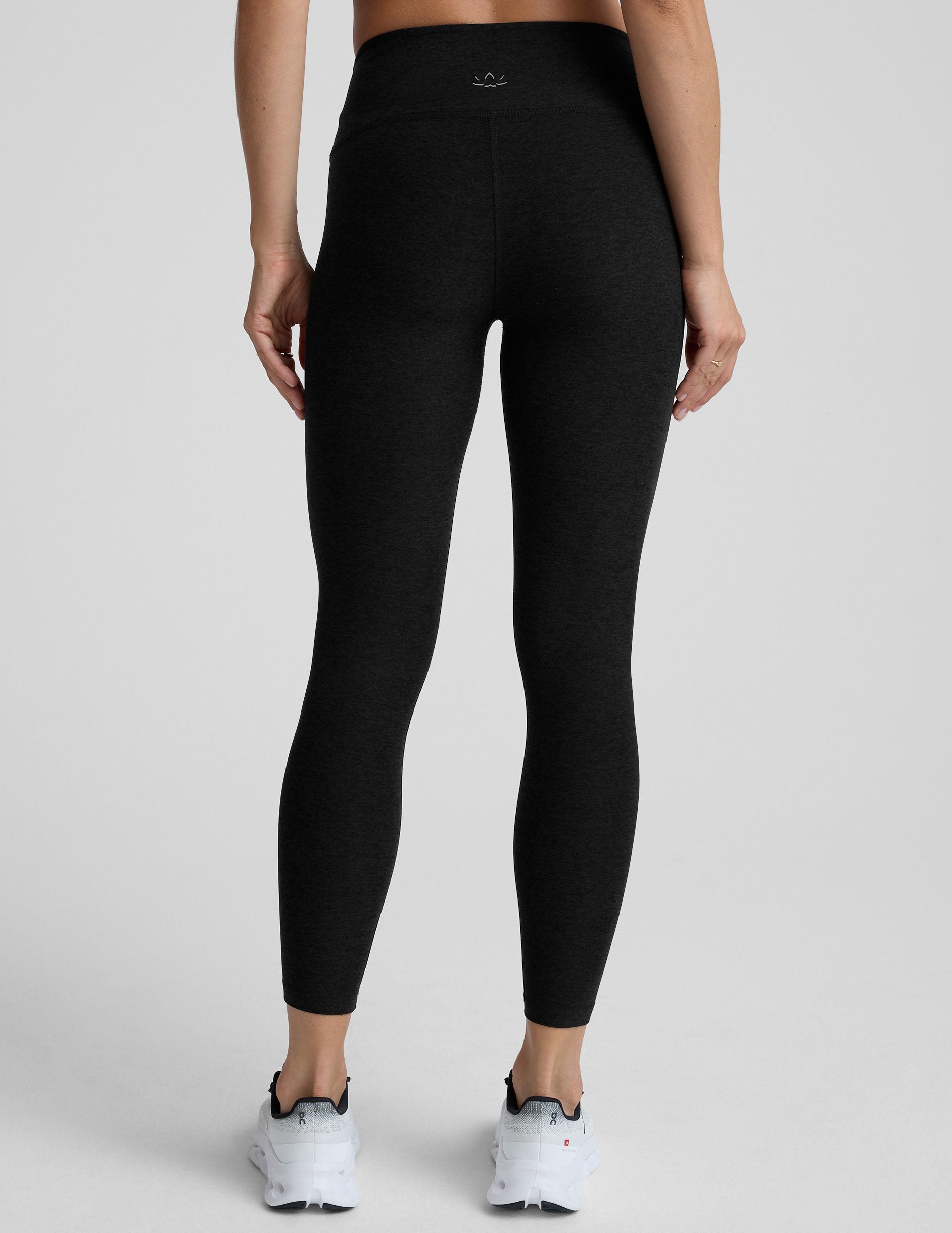 black mid-rise midi length leggings.