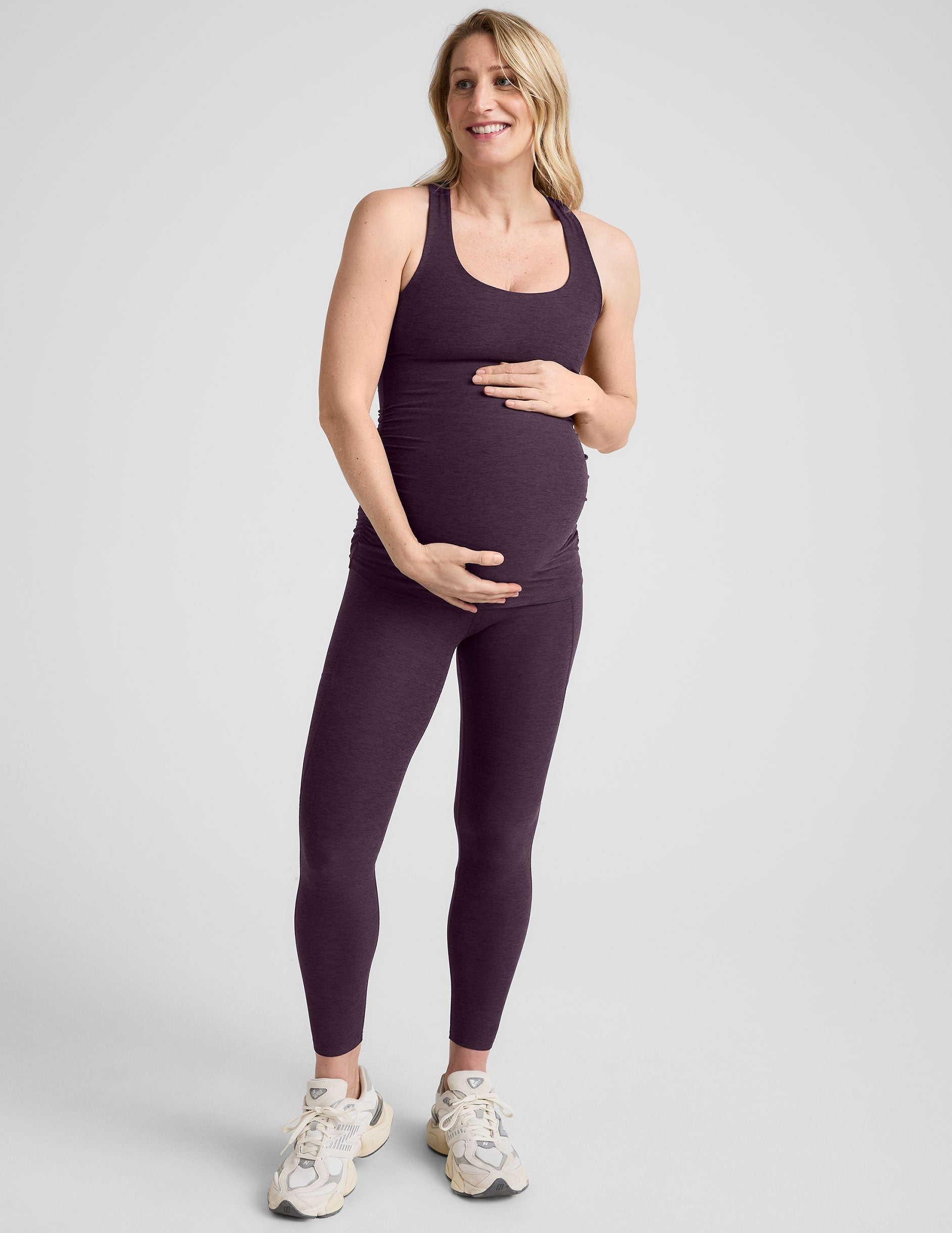purple maternity racerback tank top and purple maternity midi length leggings.