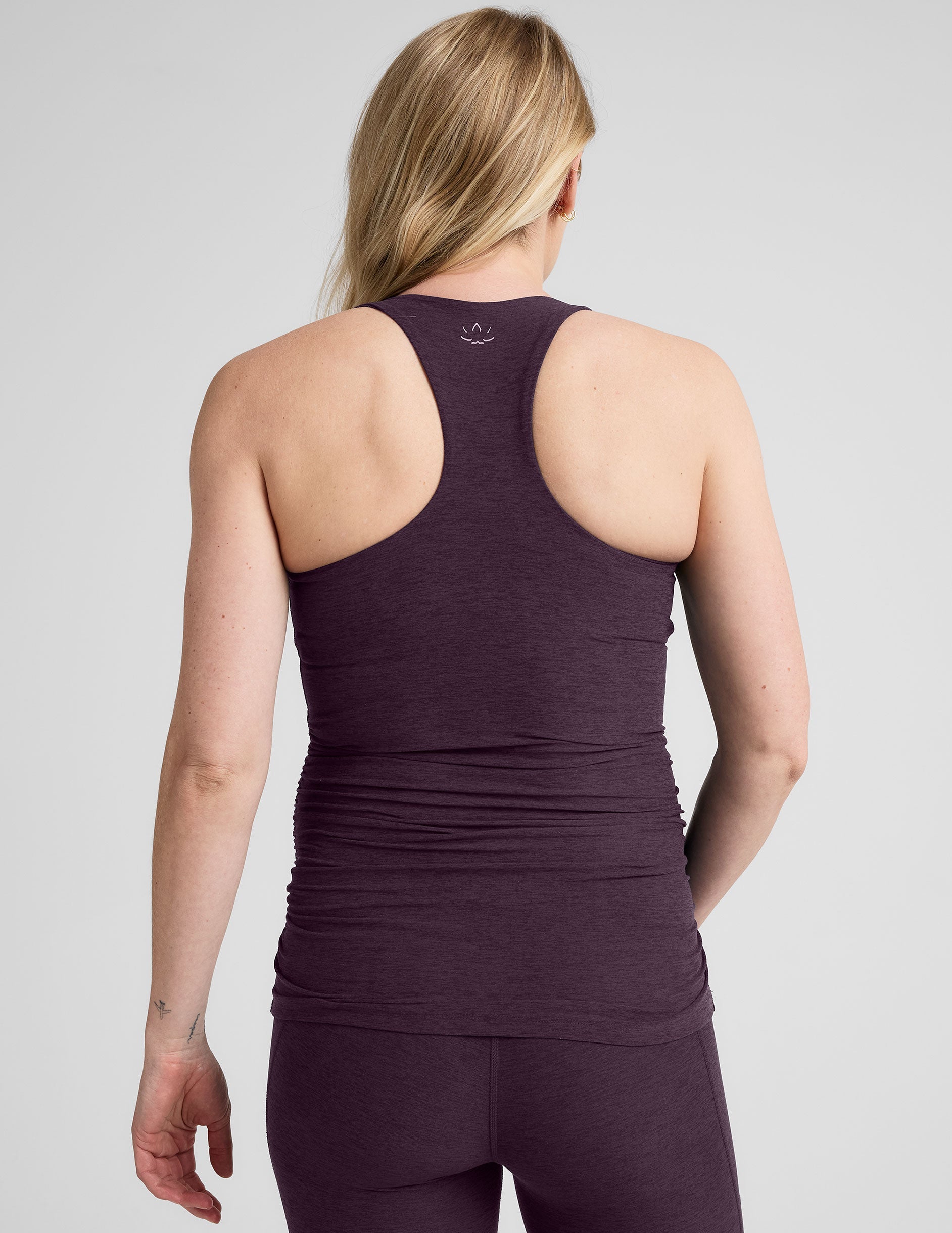 purple maternity racerback tank top and purple maternity midi length leggings.