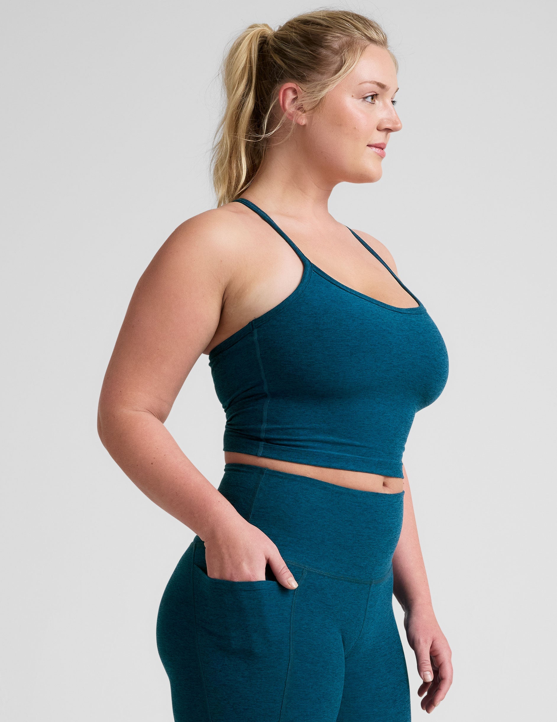 blue racerback cropped tank top with slim straps.