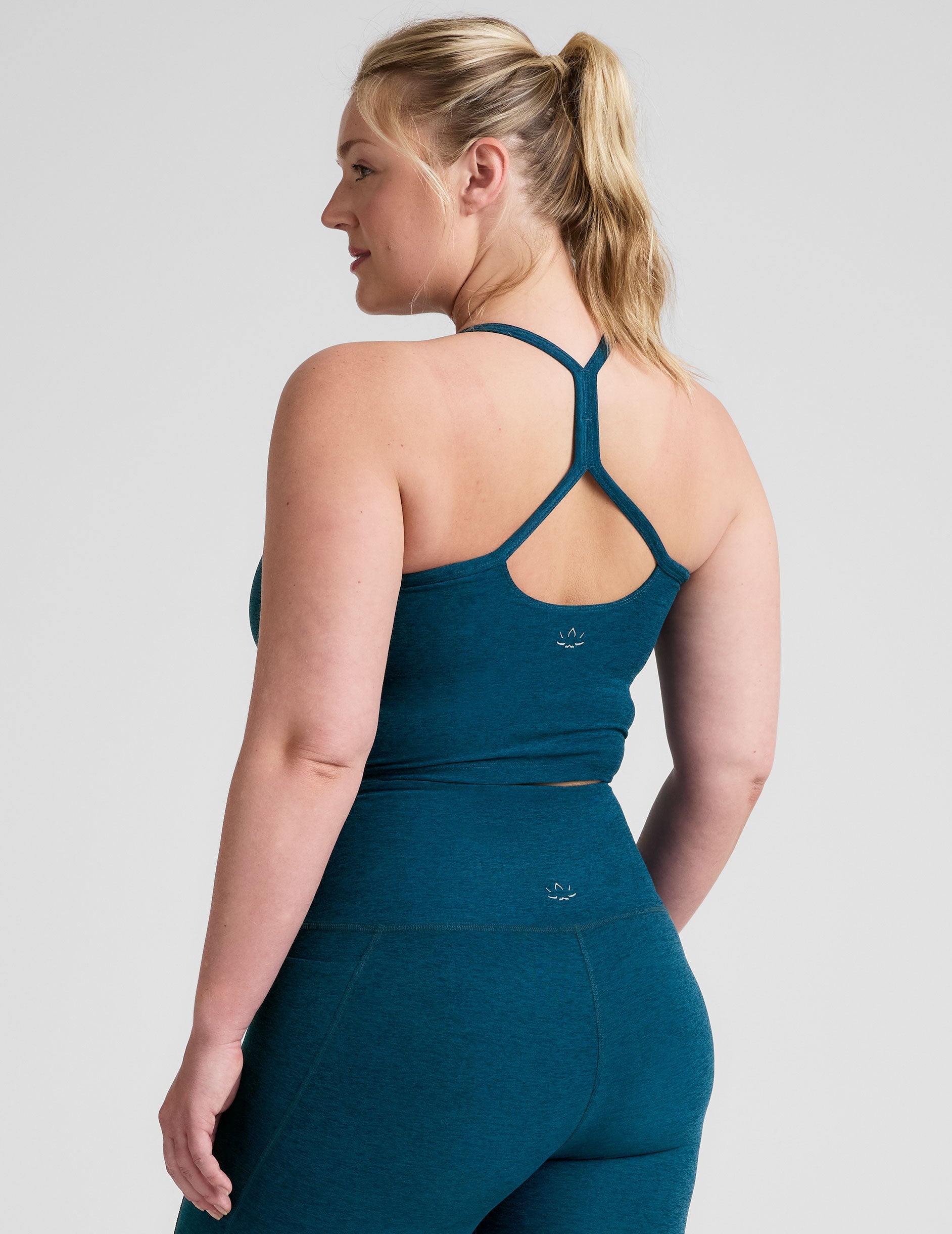 blue racerback cropped tank top with slim straps.