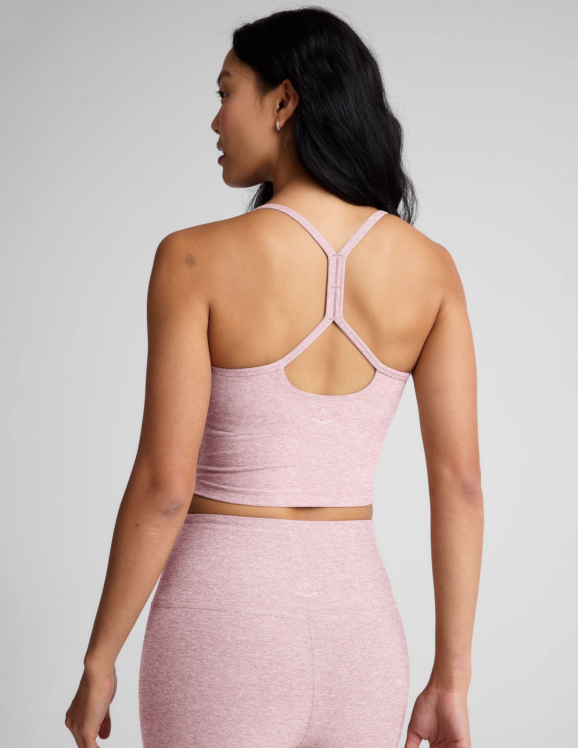 pink racerback cropped tank top with slim straps.