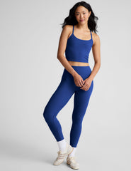 blue cropped tank top with slim spaghetti straps.