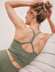 green racerback cropped tank top with thin straps.