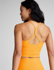 orange racerback cropped tank top with spaghetti straps.